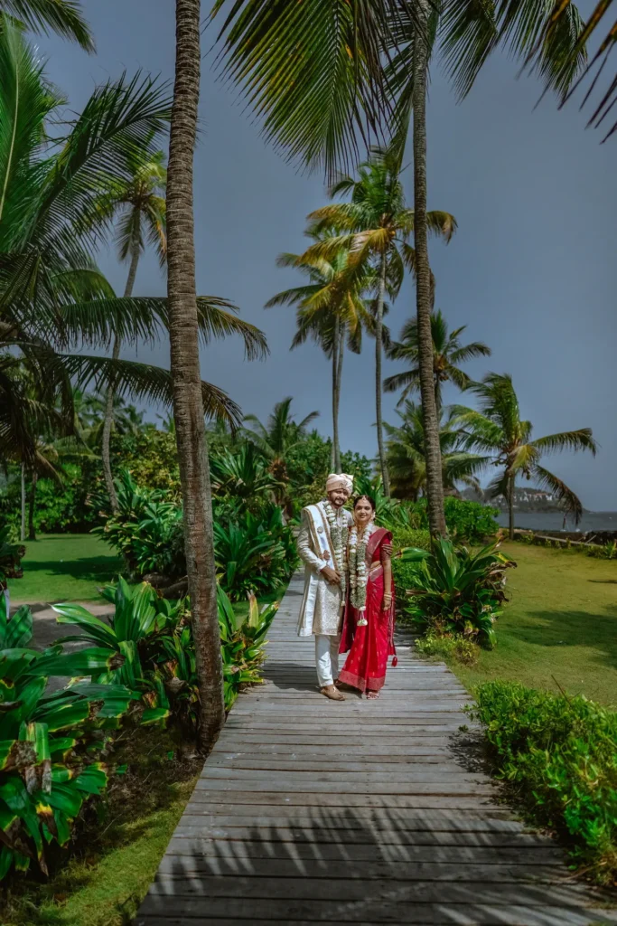 North Indian wedding couple posing by the ocean at Taj Green Cove